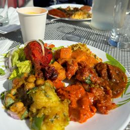 Desi Dhaba signature dishes Chilli PaneerChicken BiryaniLamb Seekh Kabab